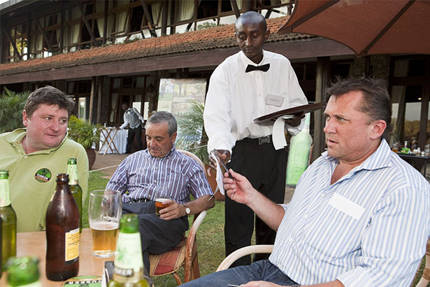 KENYA. Nairobi. The Karen Country Club. Table service outside the club. 2010.